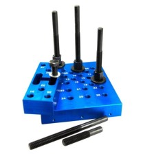 Almohadilla de prensa con pernos espaciadores, ajustable en altura, con placa pequeña y accesorios intercambiables.