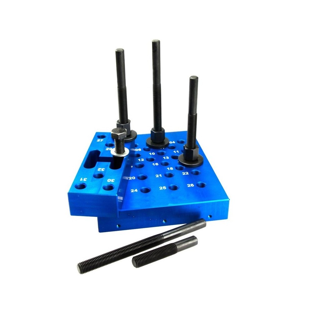 Almohadilla de prensa con pernos espaciadores, ajustable en altura, con placa pequeña y accesorios intercambiables.