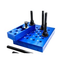 Almohadilla de prensa con pernos espaciadores, ajustable en altura, con placa pequeña y accesorios intercambiables.